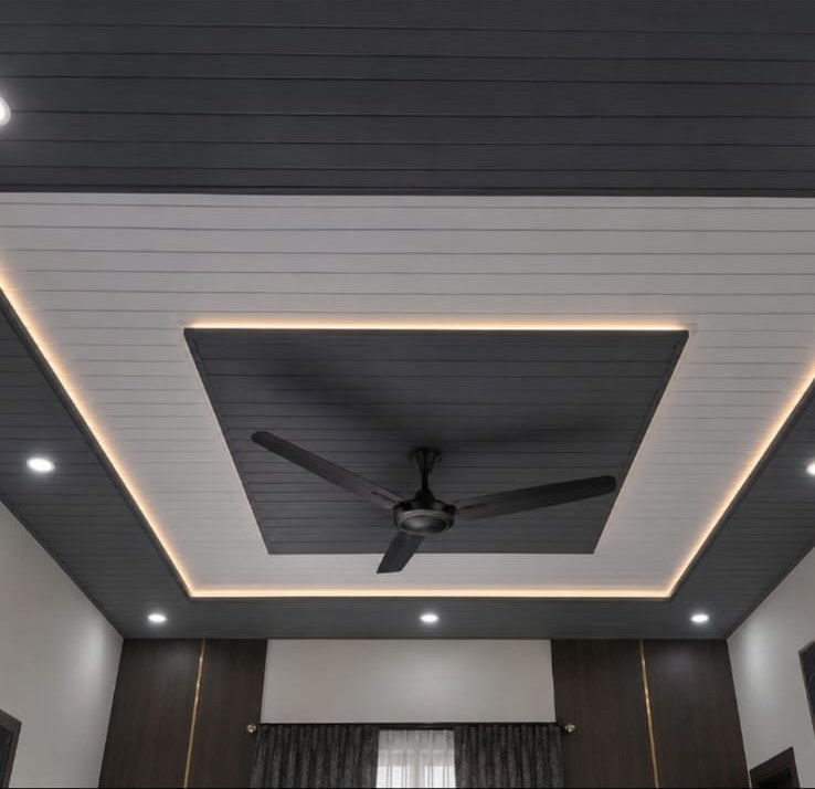Layered black and white PVC ceiling with cove lighting by Ultimate Interior Solutionz in Kingston, Jamaica